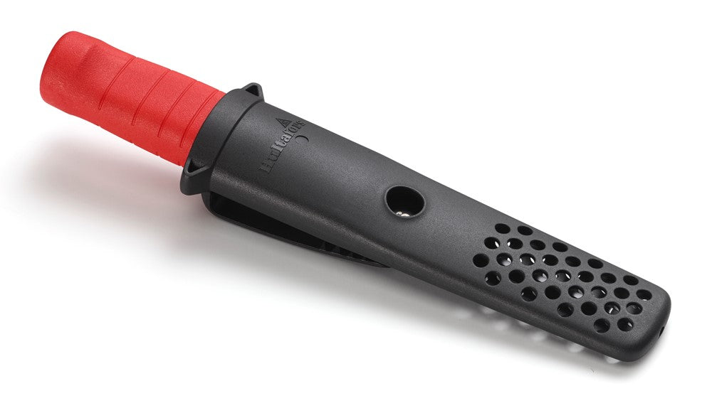 A photo of a Hultafors group chisel crafted from carbon steel, featuring a vibrant red grip and a black sheath to protect its sharp blade.