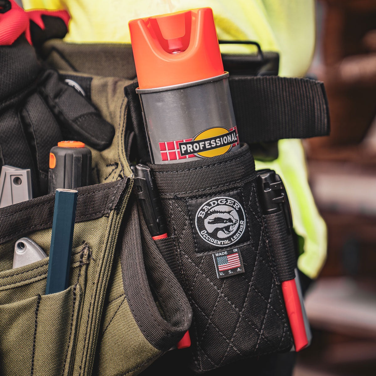 The Badger Tool Belts Spray Can Holster in Black, showing its durable 1000D nylon construction.