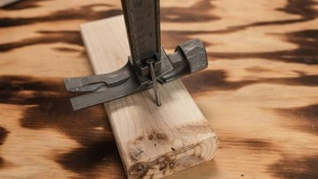 The four different nail pulling points of the Boss Hammer Pro Plus, including the side nail puller and dual top pullers.