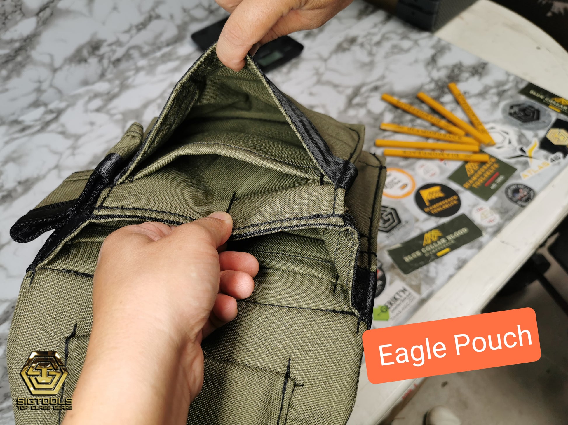 "Diamondback Eagle Pouch green colour in hand- Top from inside of the pocket View"