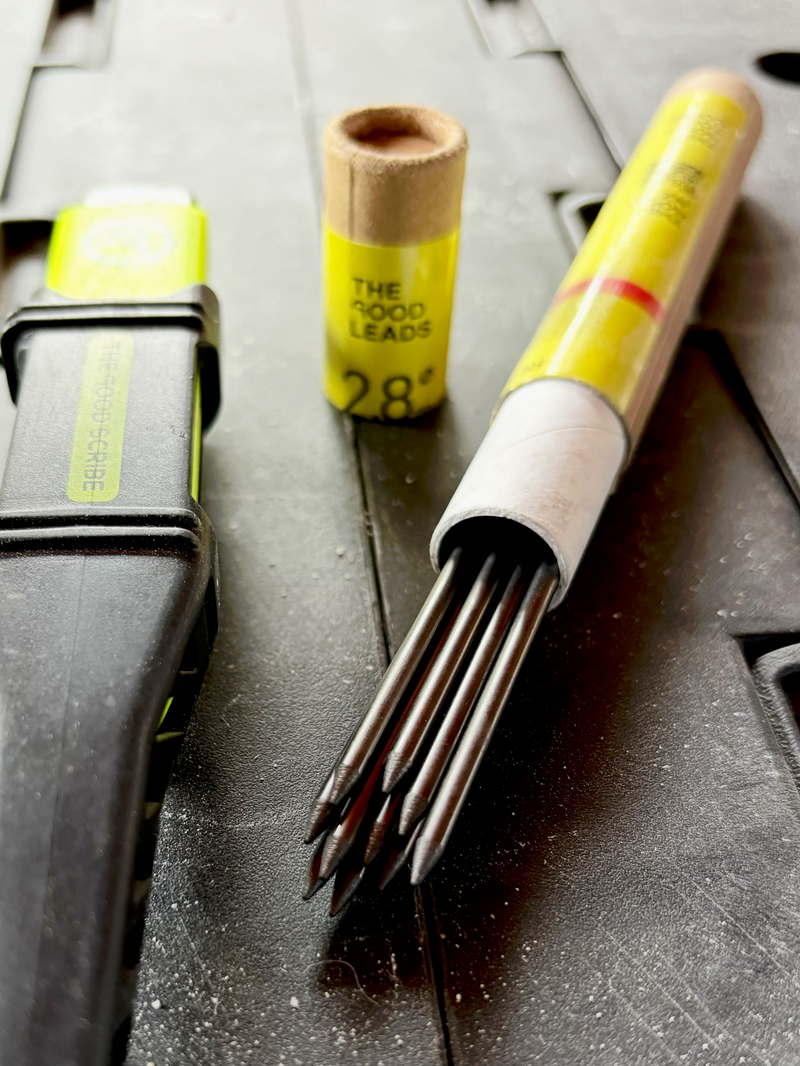 Close-up of the 12 pieces of 2.8mm hard lead spilling out of the secure, crush-resistant cardboard tube packaging.