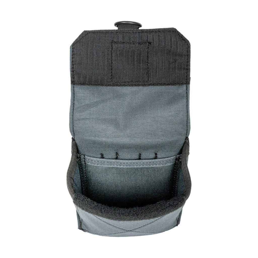 The covered flap of the Badger pouch, shown open to reveal the protected storage compartment inside.