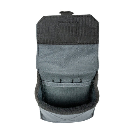 The covered flap of the Badger pouch, shown open to reveal the protected storage compartment inside.